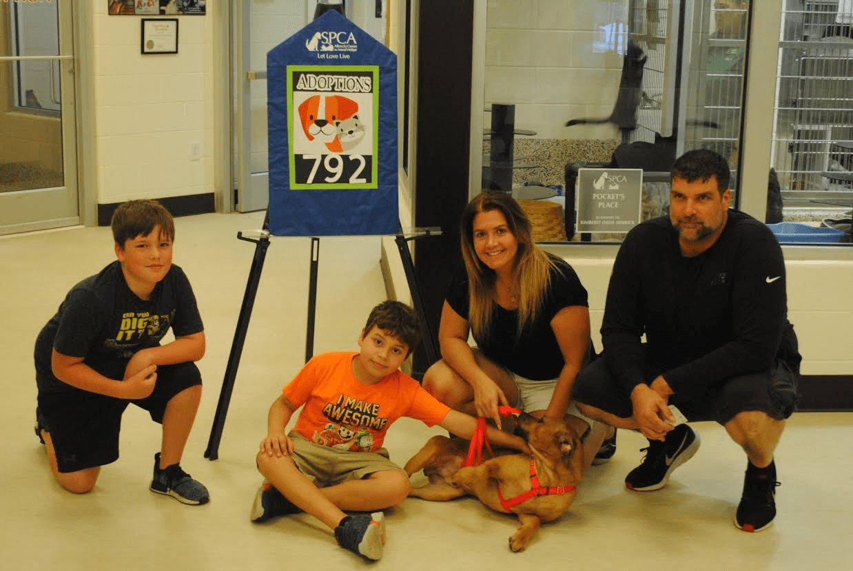 family with new adopted dog